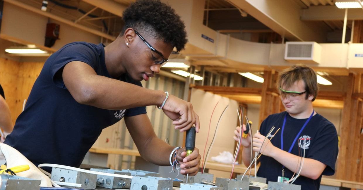 Student working with mechanical tools